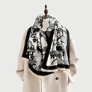Thick black and white cashmere scarf with Japanese floral patterns and fringe details