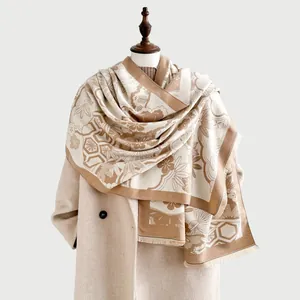 Detail of faux cashmere scarf featuring traditional floral patterns and fringe edges