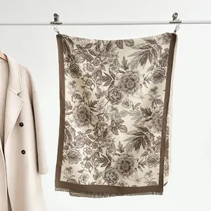Detail of floral cashmere scarf with classic Toile de Jouy pattern and fringe edges