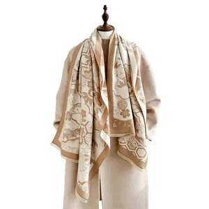 Thick beige and caramel cashmere-feel scarf with traditional floral and crane patterns