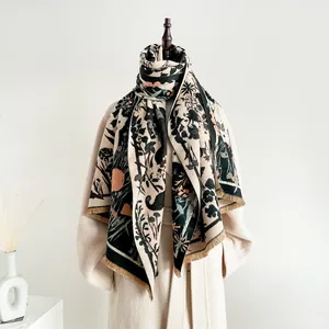 Close-up of cute cat scarf with vintage floral jacquard pattern and fringe details