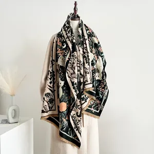 Artistic cat print scarf for women with tassels, styled over a beige winter coat