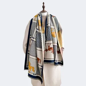 Winter scarf featuring horse motifs, geometric patterns, and fringed edges on model