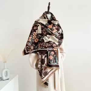 Detailed view of thick cat pattern shawl scarf with fringe and warm jacquard texture