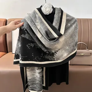 Detail of cashmere-like scarf with black and white ink landscape print and tassel edges