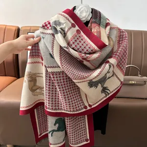 Detail of horse print scarf with houndstooth pattern and elegant fringe edges