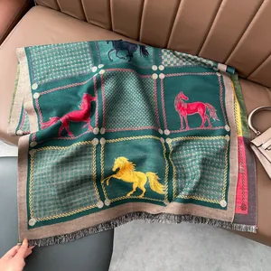 Detail of dark green cashmere scarf featuring vintage horse motifs and plaid pattern