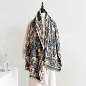 Detail of floral and animal pattern scarf with fine tassel edges on a beige coat