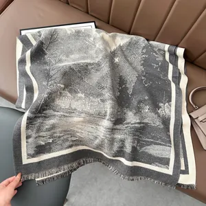 Detail of vintage landscape print scarf with fringe edges on a leather background