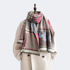 Close-up of winter horse pattern scarf showing soft cashmere texture and fringe detail