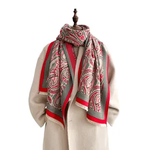 Beige paisley jacquard shawl scarf with fringes styled on a wool coat for women