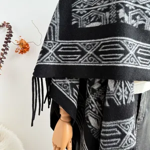 Ethnic knit shawl cardigan with geometric patterns and black tassels for women
