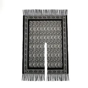 Ethnic knit shawl with black and white geometric patterns and long fringe trim