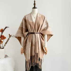 Ethnic style khaki shawl wrap with white geometric patterns and tassel details