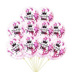 Macro view of transparent balloons with rose red confetti and printed birthday numbers