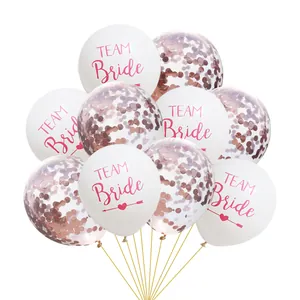 Detail of Team Bride white latex balloons and transparent rose gold confetti balloons