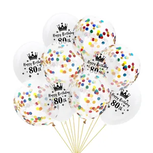 Detail of transparent 80th birthday balloons with colorful confetti and gold ribbons