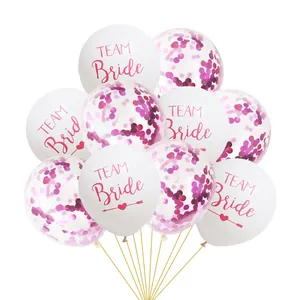 Detail of white Team Bride latex balloons and transparent balloons with pink sequins