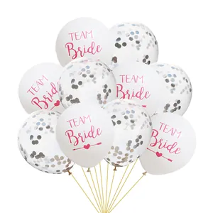 Detail of white TEAM Bride balloons with pink lettering and silver confetti party balloons