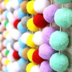 Macro shot of colorful 2-3cm plush balls for DIY children party and nursery decorations