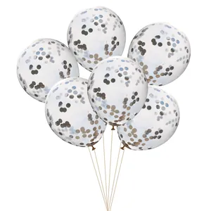 Cluster of six transparent balloons filled with rose gold confetti dots for birthdays