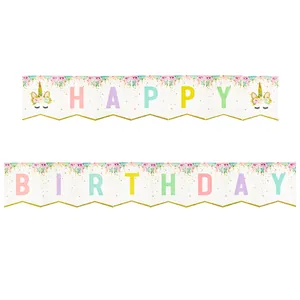 Detail of unicorn birthday banner with gold glitter horns and pastel floral patterns