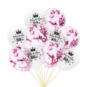 Detail of 80th birthday balloons with rose gold confetti and black crown printing