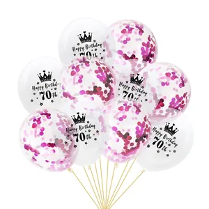 Detail of 70th birthday confetti balloons with Happy Birthday print and rose red sequins