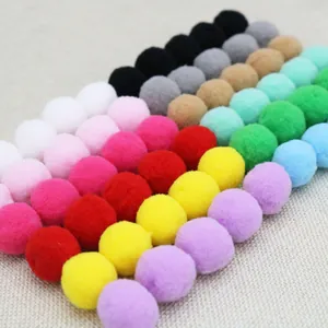 Close-up of colorful DIY pom-poms for children birthday party decorations and handicrafts