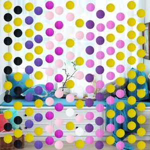 Close-up of colorful round paper garlands with glitter and matte finish for party decor