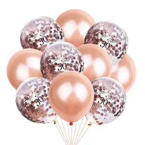 Close-up of 30th anniversary rose gold balloons with confetti and metallic finish