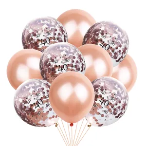 Close-up of rose gold 40th anniversary balloons with metallic and confetti details