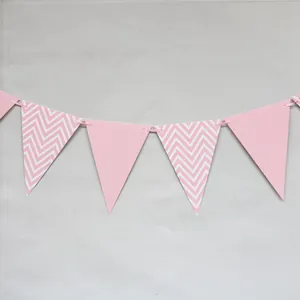 Detailed close-up of pink and white chevron patterned triangular party bunting flags