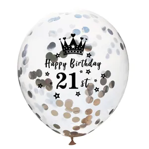 Macro detail of clear 21st birthday confetti balloon with gold sequins and crown logo