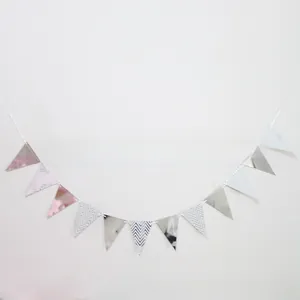 Detail of glitter silver and striped party bunting flags with a red lip centerpiece