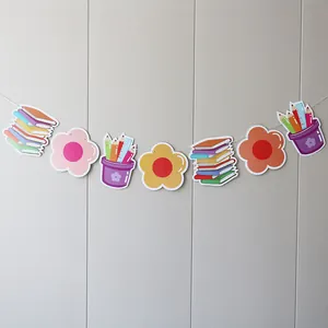 Colorful school banner with books and pencil cup decorations for classroom wall display