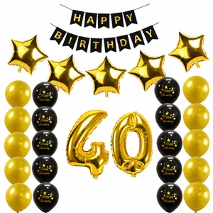 Detail of 40th birthday party set with gold foil balloons and black banner decorations