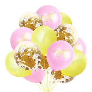 Detail of rose gold balloons with unicorn silhouette and shiny golden confetti filling