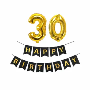 Detail of gold 30th birthday foil balloons and black happy birthday banner set