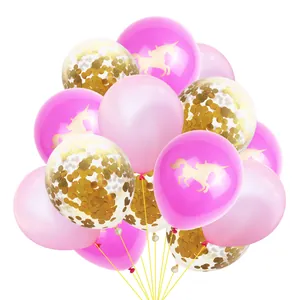Detail of rose gold balloons with unicorn silhouette and sparkling gold confetti inside