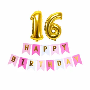 Detail of 16th birthday party set with gold number balloons and pink banner