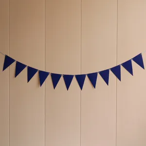 Detail of dark blue triangular bunting banner with 12 flags for party decoration