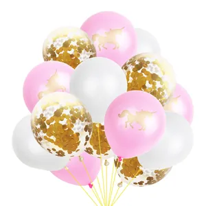 Close-up of pink unicorn balloons and transparent latex balloons with gold confetti