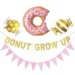 Pink donut balloon kit with Donut Grow Up glitter banner and candy foil balloons