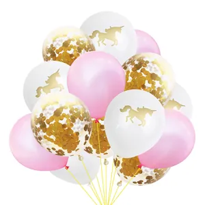 Detail of pink, white unicorn, and gold confetti party balloons tied with a yellow ribbon
