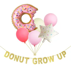 Pastel donut balloon set with Donut Grow Up glitter banner for birthday party decor