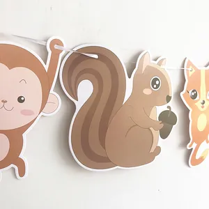 Detail of cartoon forest animal banner featuring monkey, squirrel and fox party decorations
