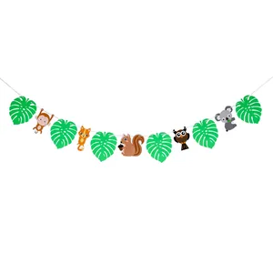 Close-up of forest animal party banners with fox, owl, and koala on cardstock