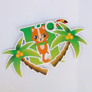 Detail of woodland party banner featuring cartoon fox and palm tree cardstock cutouts