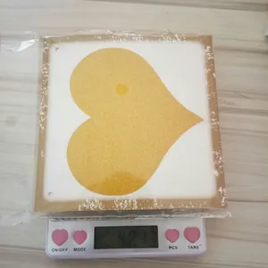 Glittery Just Married heart banner wedding party decoration weighed on a digital scale